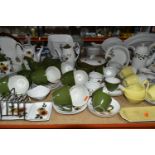 A COLLECTION OF MIDWINTER POTTERY DINNERWARES, over seventy pieces in Daisy Time, Mink Rose,