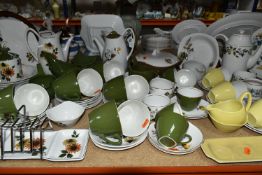 A COLLECTION OF MIDWINTER POTTERY DINNERWARES, over seventy pieces in Daisy Time, Mink Rose,