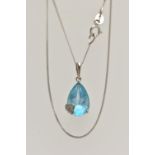 A WHITE METAL TOPAZ AND DIAMOND PENDANT NECKLACE, the pendant set with a pear cut light blue