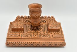 AN CONTINENTAL / EASTERN EUROPEAN INLAID AND CARVED TREEN DESKSTAND, the raised wavy back above a