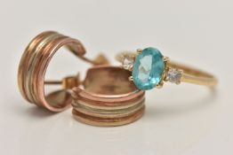 A 14CT GOLD RING AND A PAIR OF HOOP EARRINGS, the ring set with a central oval cut light blue stone,