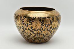 AN INDIAN HEAVY BRASS AND BLACK ENAMELLED JARDINIERE, engraved with a foliate design of stylised