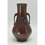 A JAPANESE MEIJI PERIOD PATINATED BRONZE TWIN HANDLED VASE OF BALUSTER FORM, cast in relief with