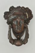 A LATE VICTORIAN NEO-CLASSICAL STYLE BRONZE DOOR KNOCKER IN THE FORM OF A FEMALE MASK, height