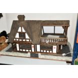 A TUDOR STYLE DOLLS HOUSE BY ROBERT STUBBS, with a signed certificate of authenticity, three