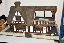 A TUDOR STYLE DOLLS HOUSE BY ROBERT STUBBS, with a signed certificate of authenticity, three