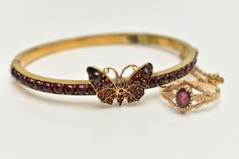 A 9CT GOLD GEM SET RING AND A HINGED BANGLE, oval cut garnet, prong set in yellow gold, hallmarked