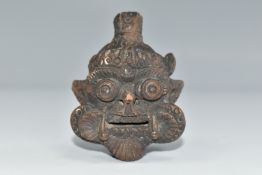 A TERRACOTTA AMULET OF THE MESOPOTAMIAN GOD PAZUZU, height 7.5cm (Condition Report: chipped nose,