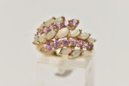 A 9CT GOLD OPAL AND PINK SAPPHIRE DRESS RING, designed with two rows of asymmetrically set