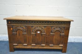 A OAK BLANKET CHEST, with an arched design panel front, width 107cm x depth 49cm x height 63cm (