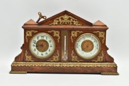 AN EARLY 20TH CENTURY OAK AND GILT METAL MOUNTED MANTEL CLOCK / BAROMETER OF ARCHITECTURAL FORM, the