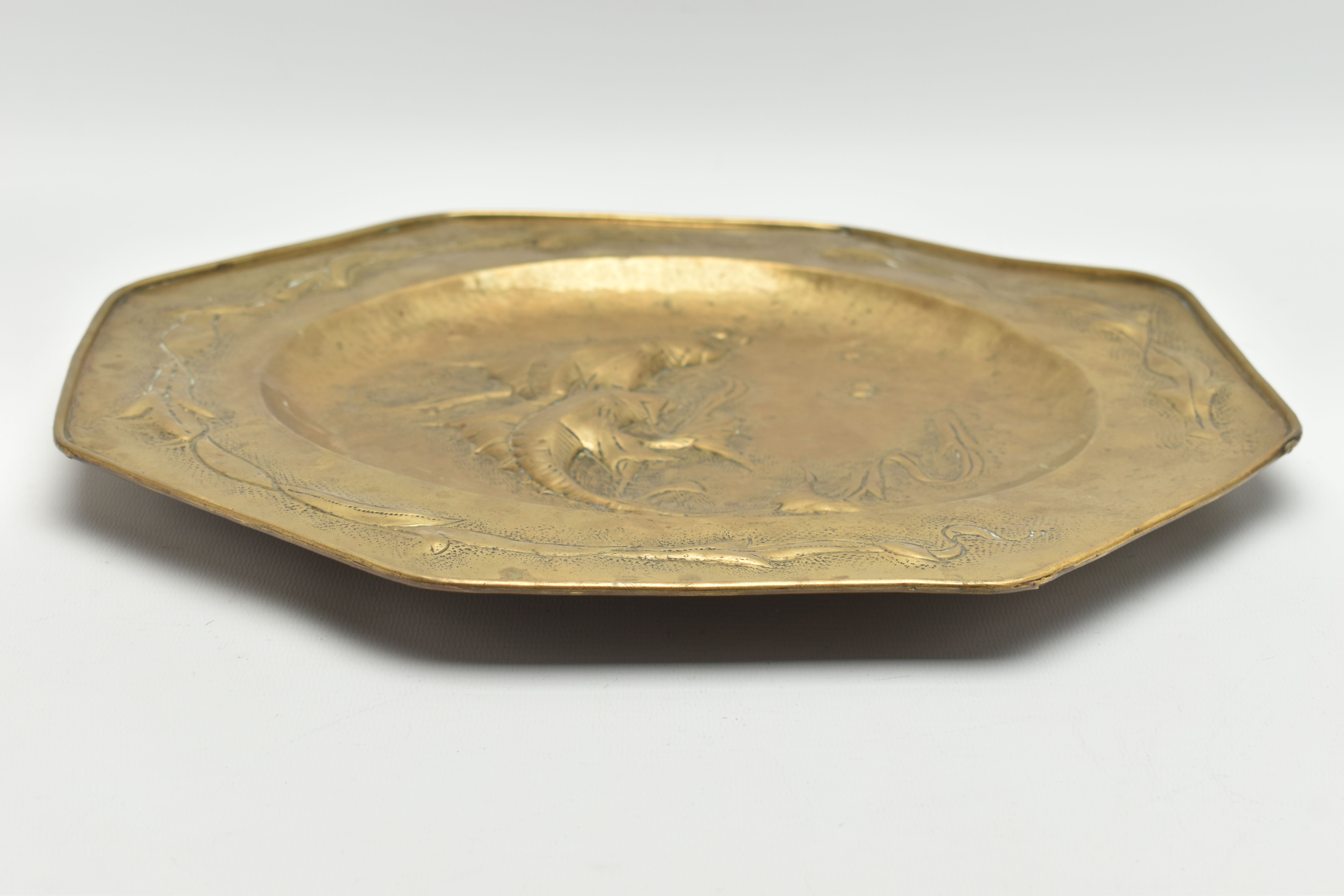 MANNER OF JOHN PEARSON, AN OCTAGONAL ARTS & CRAFTS BRASS CHARGER, embossed with two fish to the - Image 5 of 7