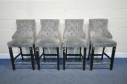 A SET OF FOUR BUTTONED GREY HIGH CHAIRS, on an ebonised base (condition report: dents and