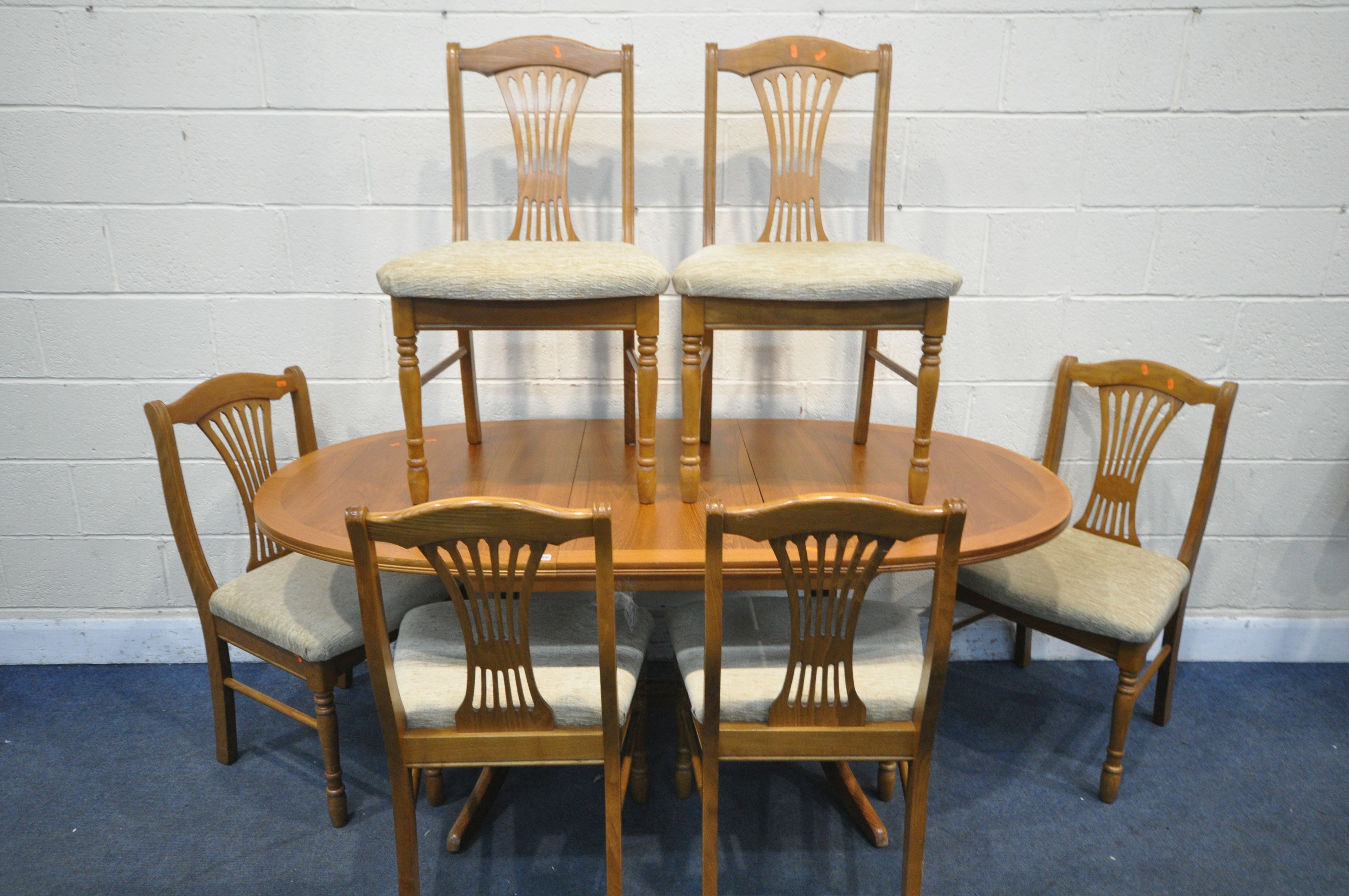 A NATHAN TEAK DINING SUITE, comprising an extending dining table, extended length 175cm x closed