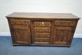 A GEORGIAN AND LATER OAK DRESSER BASE, with six drawers and two cupboard doors, width 167cm x