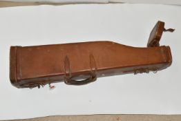 A GOOD QUALITY LEATHER SHOTGUN CASE WITH METALLIC LOCK, its case straps need replacing