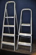 TWO SETS OF ALUMINIUM STEP LADDERS, largest set height 139cm (condition report: both with signs of