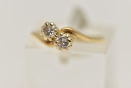 AN 18CT GOLD DIAMOND TOI ET MOI STYLE RING, two round brilliant cut diamonds, prong set in yellow