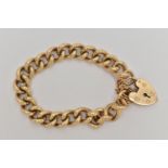 A HEAVY 9CT GOLD BRACELET, solid curb links, hallmarked 9ct Sheffield, fitted with a large heart