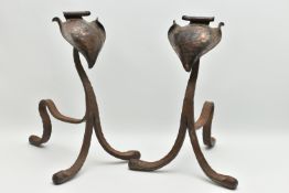 A PAIR OF ARTS AND CRAFTS PLANISHED COPPER AND WROUGHT IRON FIRE DOGS, with scrolled spade shaped