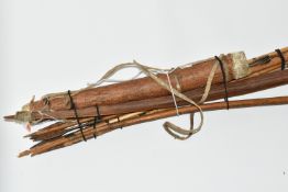 A VERY INTERESTING LONG BOW, ARROWS AND QUIVER OF NATIVE ORIGINS, the quiver is made from a hollowed