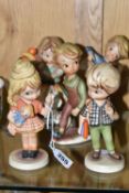 FIVE PM & M CORTENDORF CERAMIC FIGURES, of stylised children, comprising a boy with books and