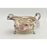 A MID 20TH CENTURY SILVER GRAVY BOAT, polished form, gadrooned rim, on three cabriolet legs,