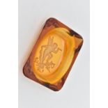 AN ART DECO RECTANGULAR AMBER GLASS PIN DISH, the base with intaglio engraved with a classical
