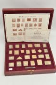 A CASED 'THE EMPIRE COLLECTION' GOLD PLATED SILVER STAMPS, set containing twenty-five stamps with