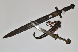 AN ARAB JAMBIYA DAGGER, in its original tooled scabbard with a flared end to its hilt and fitted