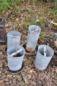 FOUR VINTAGE GALVANISED CHICKEN FEEDERS of two different sizes the tallest being 62cm
