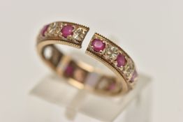 A 9CT GOLD FULL ETERNITY RING, AF split shank, missing a ruby, set with rubies and single cut