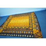 A 1970'S ORANGE PATTERNED RUG, 258cm x 227cm, label to underside reading scanrya (condition