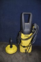 A KARCHER K2 PRESSURE WASHER, with lance, two nozzles and a Patio attachment (PAT pass and working)