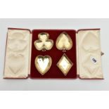 A CASED SET OF EDWARDIAN SILVER GILT DISHES IN THE FORM OF PLAYING CARD SUITS, maker's mark