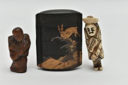 A LATE 19TH CENTURY JAPANESE BLACK LACQUERED FOUR SECTION INRO WITH HARES JUMPING ABOVE WAVES, one