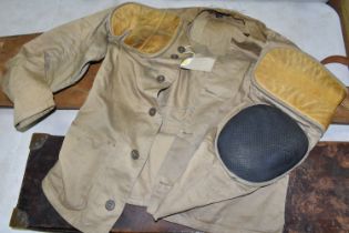 A GOOD QUALITY RIFLE SHOOTING JACKET, a leather on oak shotgun case and a superb high quality fur