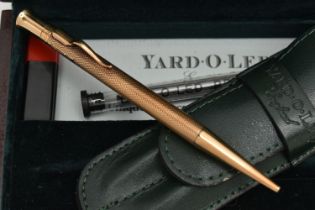 A BOXED 9CT GOLD 'YARD-O-LED' PROPELLING PENCIL, engine turned pattern, personal engraving reads '