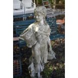 A WEATHERED COMPOSITE GARDEN STATUE, of a scantily lady carrying baskets, height 136cm (condition