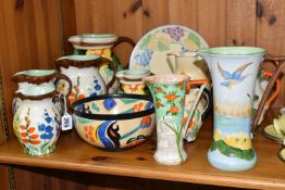 A COLLECTION OF ART DECO FLORAL DESIGNED HANCOCK'S IVORY WARE, comprising eleven jugs, including
