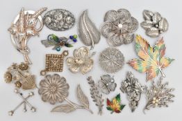 AN ASSORTMENT OF WHITE METAL BROOCHES, eighteen brooches floral and foliage designed brooches,