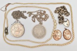 A SELECTION OF JEWELLERY, to include two commemorative coin pendants, two imitation pearl necklaces,
