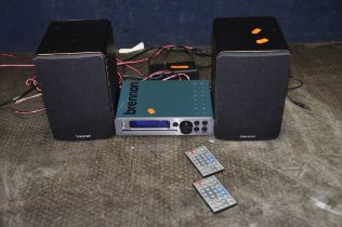 A BRENNAN JB7 MUSIC PLAYER, with matching speakers and two remotes (PAT pass and working)