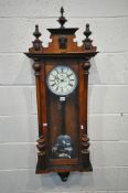 A 19TH CENTURY WALNUT VIENNA REGULATOR WALL CLOCK, with turned finials, the seven inch enamel dial