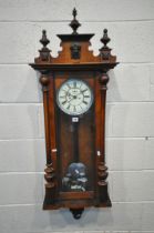 A 19TH CENTURY WALNUT VIENNA REGULATOR WALL CLOCK, with turned finials, the seven inch enamel dial