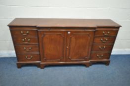 A MODERN MAHOGANY BREAKFRONT SIDEBOARD, with two drawers , and four cupboard doors, and a brushing