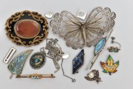 A SMALL BAG OF BROOCHES, to include a gold plated oval brooch, set with a central carnelian inlay,