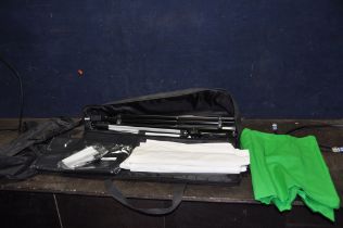 A BAG CONTAINING PHOTOGRAPHIC GREEN, WHITE AND BLACK SCREENS, four stands, a tripod and a reflector