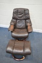 AN EKORNES STRESSLESS BROWN LEATHER SWIVEL RECLINING ARMCHAIR, and footstool (condition report: wear