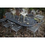 A CAST METAL OVAL GARDEN TABLE, possibly by Hartman, length 222cm x depth 107cm x height 73cm, and